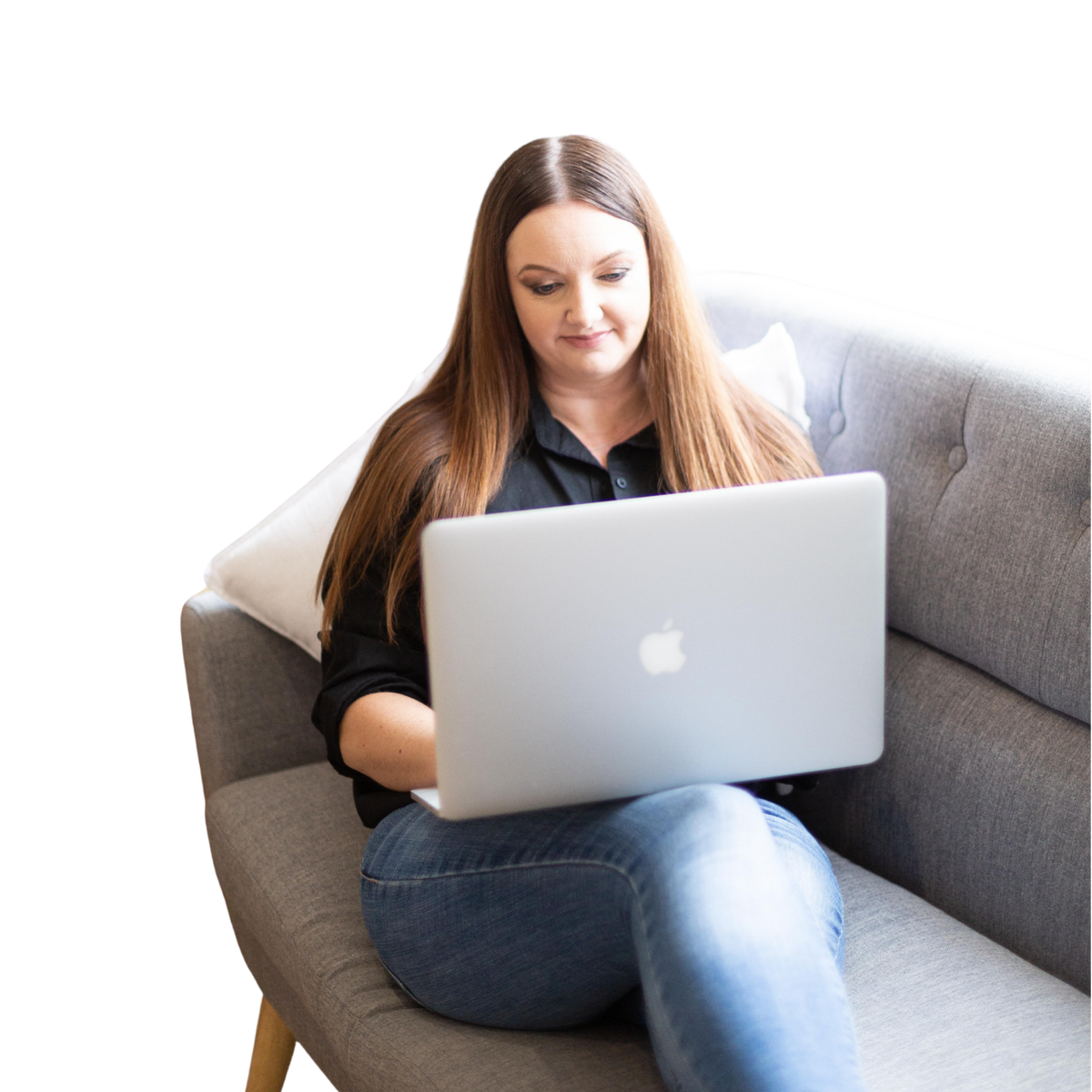 Woman (Anchen le Roux from Simply digital Shops using a laptop on a gray couch